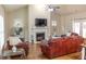 Comfortable living room with a fireplace, hardwood floors, and plenty of seating at 1960 Overlook Springs Ln, Cumming, GA 30040
