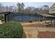 Well-maintained tennis courts with viewing benches in a community setting at 1960 Overlook Springs Ln, Cumming, GA 30040