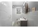 Beautiful, remodeled bathroom with a marble tile shower and modern vanity at 5273 Crystal Ln, Atlanta, GA 30349