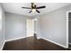 This bedroom has dark hardwood floors, neutral walls, and a closet to store your belongings at 5273 Crystal Ln, Atlanta, GA 30349