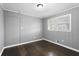 Bright bedroom with dark hardwood floors, neutral walls, and a window to let the sun shine in at 5273 Crystal Ln, Atlanta, GA 30349