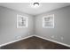 Bright bedroom with dark hardwood floors, neutral walls, and a window to let the sun shine in at 5273 Crystal Ln, Atlanta, GA 30349