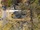 Aerial view of the home featuring a new roof, driveway and mature trees at 936 Byron Sw Dr, Atlanta, GA 30310