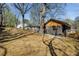 Spacious backyard features a lush lawn and mature trees, perfect for outdoor activities at 936 Byron Sw Dr, Atlanta, GA 30310