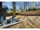 Backyard with patio, seating, a firepit, and a wood fence at 936 Byron Sw Dr, Atlanta, GA 30310