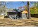 Charming backyard features patio with chairs and a fire pit, perfect for outdoor relaxation at 936 Byron Sw Dr, Atlanta, GA 30310