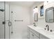 Bathroom showcasing double sink vanity with modern fixtures and glass-enclosed shower at 936 Byron Sw Dr, Atlanta, GA 30310