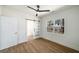 Bedroom with a ceiling fan and a sliding glass door that leads to a bathroom at 936 Byron Sw Dr, Atlanta, GA 30310