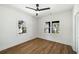 A naturally lit bedroom with hardwood floors and a ceiling fan at 936 Byron Sw Dr, Atlanta, GA 30310