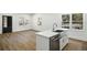 Kitchen features stainless steel appliances, quartz countertops, undermount sink, and hardwood floors at 936 Byron Sw Dr, Atlanta, GA 30310