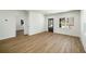 Spacious living area showcasing wood floors and an adjacent room at 936 Byron Sw Dr, Atlanta, GA 30310
