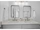 Elegant bathroom features double sinks, quartz countertops, modern fixtures, and custom mirrors at 112 Rosaire Nw Pl, Atlanta, GA 30327