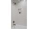 Stylish bathroom features white subway tile, a recessed shower niche, and a rainfall shower head at 112 Rosaire Nw Pl, Atlanta, GA 30327