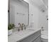 Modern bathroom with a marble countertop, sleek fixtures, and a walk-in shower at 112 Rosaire Nw Pl, Atlanta, GA 30327