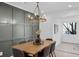 Dining room boasts a wooden table and modern decorative wall at 112 Rosaire Nw Pl, Atlanta, GA 30327