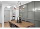 Dining room boasts a wooden table and modern decorative wall at 112 Rosaire Nw Pl, Atlanta, GA 30327