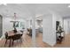 Open dining room with a view of the kitchen and modern chandelier at 112 Rosaire Nw Pl, Atlanta, GA 30327