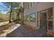 Exterior view showing private patio with natural landscaping, including walking path and mature trees at 112 Rosaire Nw Pl, Atlanta, GA 30327