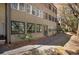 Exterior view showing private patio with natural landscaping, including walking path and mature trees at 112 Rosaire Nw Pl, Atlanta, GA 30327