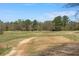 Expansive golf course view, showcasing the lush greens and natural landscape of the community at 112 Rosaire Nw Pl, Atlanta, GA 30327