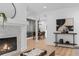 Open-concept living space with a fireplace and view of the dining area, perfect for entertaining at 112 Rosaire Nw Pl, Atlanta, GA 30327