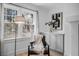 Serene corner of living room with a comfortable chair, stylish decor, and a view from the window at 112 Rosaire Nw Pl, Atlanta, GA 30327