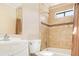 Bathroom featuring neutral tile, shower head, shower curtain, mirror, and sink at 1472 Hartman Sw Dr, Lilburn, GA 30047