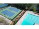 Aerial view of the community pool and tennis courts, offering recreational opportunities for residents at 1472 Hartman Sw Dr, Lilburn, GA 30047