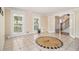 Dining room featuring an intricate tile floor and staircase access at 1472 Hartman Sw Dr, Lilburn, GA 30047