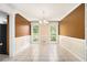 Formal dining room featuring wainscotting and chandelier lighting at 1472 Hartman Sw Dr, Lilburn, GA 30047