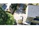 An aerial view of the home's driveway, roof and backyard with mature trees, lawn, and landscaping at 1472 Hartman Sw Dr, Lilburn, GA 30047