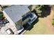 This aerial shot reveals a beautiful multi-level deck, lush green lawn, and well-maintained exterior at 1472 Hartman Sw Dr, Lilburn, GA 30047