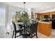 Eat-in kitchen features a dining table and modern appliances at 1472 Hartman Sw Dr, Lilburn, GA 30047