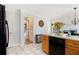 Open kitchen with stainless steel appliances, cabinetry and an island with a dishwasher at 1472 Hartman Sw Dr, Lilburn, GA 30047