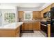 Kitchen featuring tile floor, countertop space and a view at 1472 Hartman Sw Dr, Lilburn, GA 30047