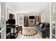 Comfortable living room featuring tile floors and natural lighting at 1472 Hartman Sw Dr, Lilburn, GA 30047
