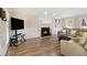 Inviting living room with hardwood floors and a cozy fireplace, perfect for relaxation at 1472 Hartman Sw Dr, Lilburn, GA 30047