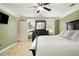Bright and airy main bedroom with carpet flooring at 1472 Hartman Sw Dr, Lilburn, GA 30047