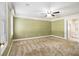 Large main bedroom featuring carpet, crown molding and an ensuite bathroom at 1472 Hartman Sw Dr, Lilburn, GA 30047