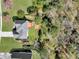 Overhead view highlighting a home's backyard with a spacious deck, blending into the surrounding wooded landscape at 3670 Cedar Springs Ln, Loganville, GA 30052