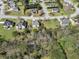 Scenic aerial perspective capturing a residential neighborhood with tree-lined streets and beautifully landscaped lawns at 3670 Cedar Springs Ln, Loganville, GA 30052