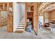 Unfinished basement offering potential for customization, showcasing stairs, and the framing at 3670 Cedar Springs Ln, Loganville, GA 30052