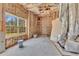 Unfinished basement with open space, large window, and exposed insulation at 3670 Cedar Springs Ln, Loganville, GA 30052