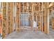 Unfinished bathroom with tiled shower, open framing and new tile flooring at 3670 Cedar Springs Ln, Loganville, GA 30052