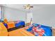 This bedroom features two twin beds with orange accents and hardwood floors at 3670 Cedar Springs Ln, Loganville, GA 30052