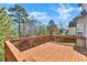 Large wooden deck perfect for outdoor entertaining and relaxing with views of the backyard at 3670 Cedar Springs Ln, Loganville, GA 30052