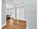 Inviting entryway with light blue walls, hardwood floors, white trim, and abundant natural light at 3670 Cedar Springs Ln, Loganville, GA 30052