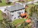 Aerial view of the gray two-story home with a wooden deck overlooking a spacious backyard at 3670 Cedar Springs Ln, Loganville, GA 30052