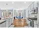 Bright, updated kitchen with stainless steel appliances, granite countertops, and a cozy breakfast nook at 3670 Cedar Springs Ln, Loganville, GA 30052