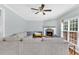 Comfortable living room featuring hardwood floors, fireplace, and a sectional sofa for relaxation at 3670 Cedar Springs Ln, Loganville, GA 30052